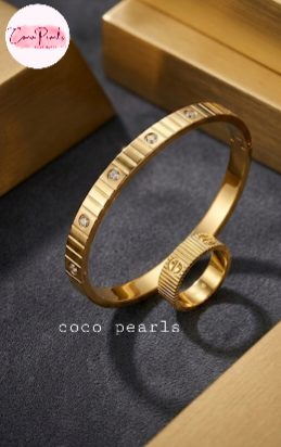 coco pearls stainless steel anti tarnish golden diamond striped handcuff and ring. diamond studded and striped