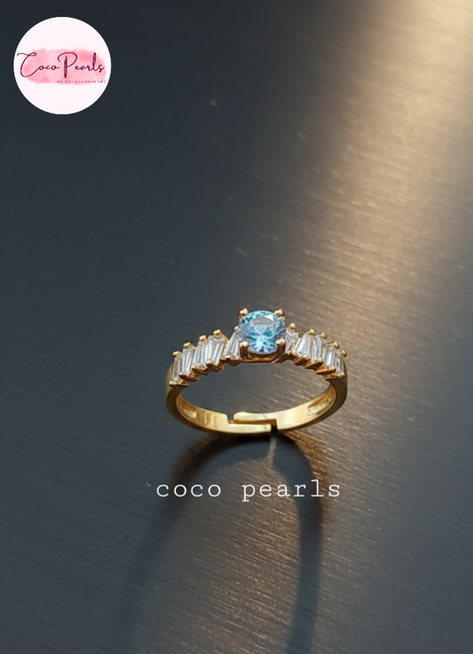 coco pearls stainless steel anti tarnish gold diamond whisper adjustable diamond studded ring displayed on metallic surface