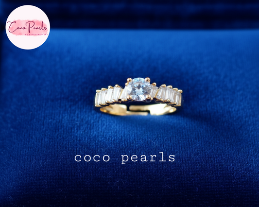 coco pearls stainless steel anti tarnish gold diamond whisper adjustable diamond studded ring displayed on blue background