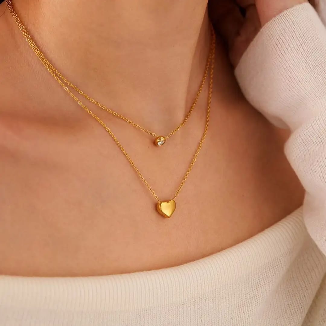 Coco Pearls Stainless Steel Anti Tarnish heart and diamond two layer necklace diamond and heart necklace Close-up of a person wearing double layer necklaces