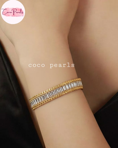 Coco Pearls Stainless Steel Anti Tarnish Gold elegant twist bracelet with clear stones on a wrist