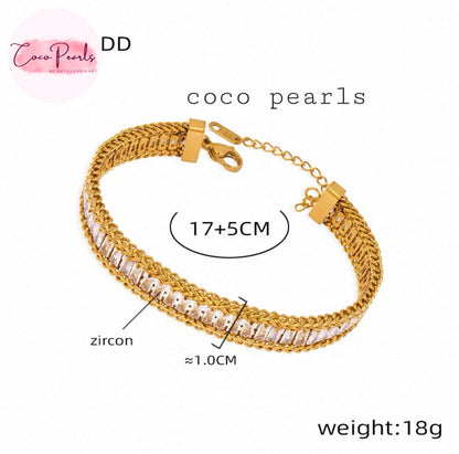 Coco Pearls Stainless Steel Anti Tarnish Gold elegant twist bracelet with zircon stones on a white background