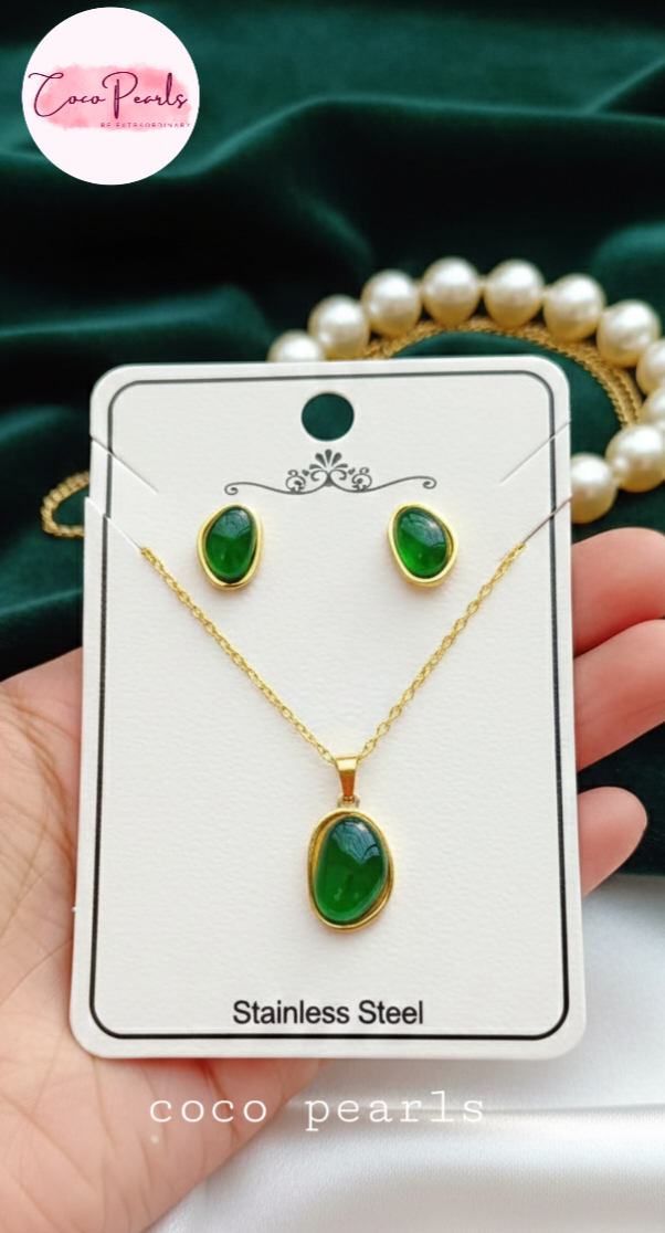 coco pearls stainless steel anti tarnish gold Jewelry set with green gemstones and gold accents on a card