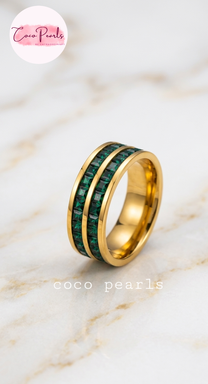 Coco pearls stainless Steel anti tarnish gold emerald empire band ring with twonlayers of emarald green zircon stones all over band displayed on simple background 