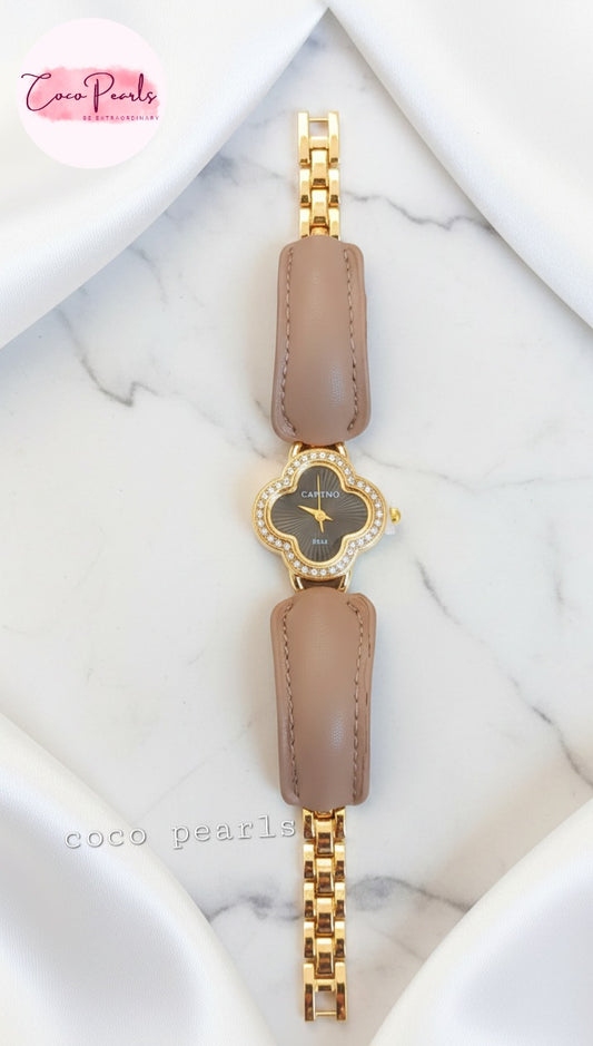 coco pearls Gold and brown watch with a marble background