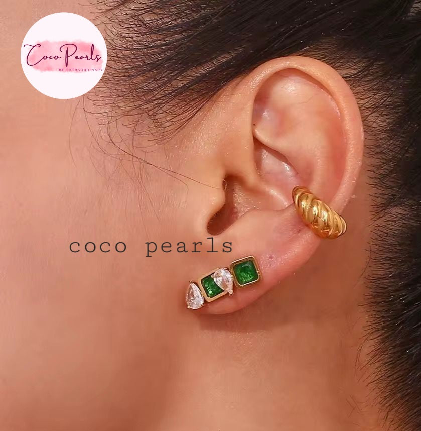 Coco Pearls Stainless Steel Anti Tarnish Gold gem studs. green earrings worn by a person