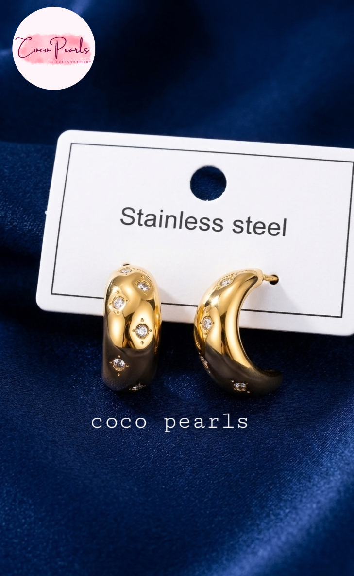 coco pearls stainless steel anti tarnish golden glitz curve diamond studded hoops displayed in a card