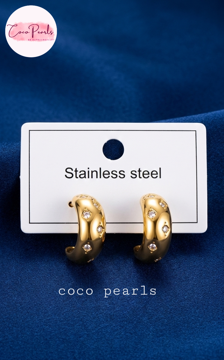 coco pearls stainless steel anti tarnish golden glitz curve diamond studded hoops displayed in a card