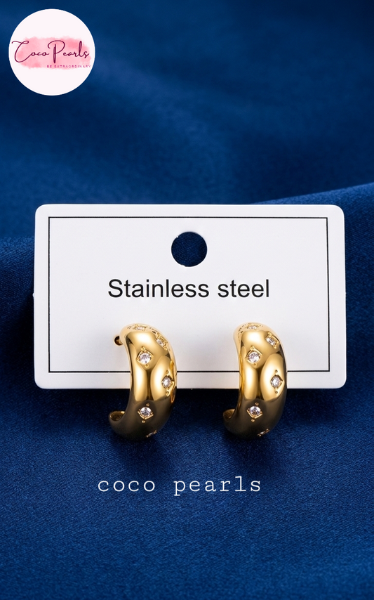 coco pearls stainless steel anti tarnish golden glitz curve diamond studded hoops displayed in a card