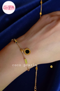 Coco Pearls Stainless steel anti tarnish Gold geometry bracelet with black gemstone hanging displayed on a white background,