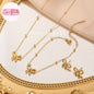 Coco Pearls Stainless Steel Anti tarnish Gold bow necklace set with bow designs on a decorative stand