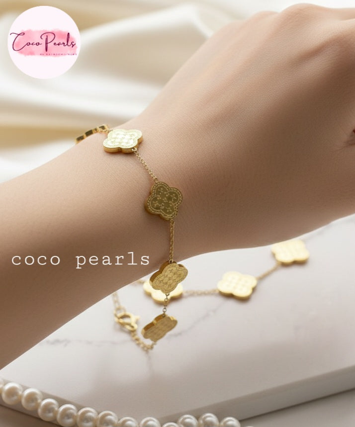 Coco Pearls Stainless steel Anti Tarnish Golden fortune bracelet with clover-shaped charms on wrist