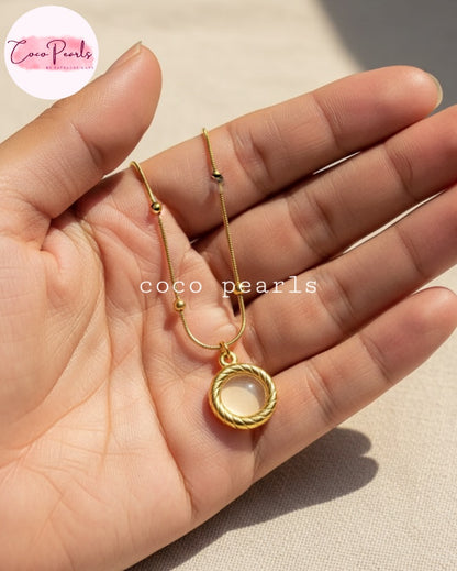 Coco Pearls Stainless Steel Anti Tarnish Golden oasis necklace with a pendant on hand