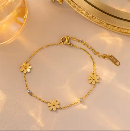 Coco Peals Stainless Steel anti  tarnish Golden petals bracelet with floral and diamond designs on a light background