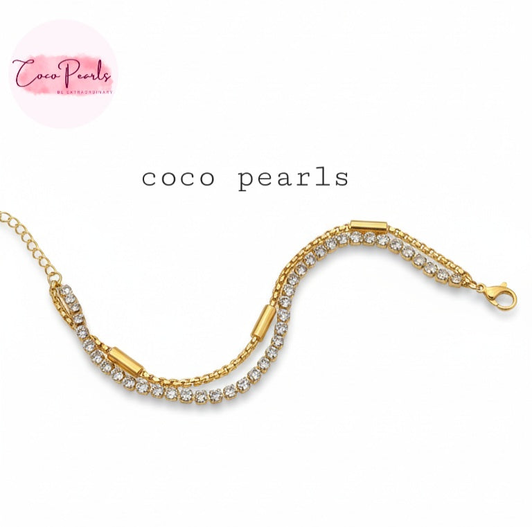 Coco Pearls Stainless steel Anti Tarnish Golden stream link bracelet with double layer chain. a diamond studded line and golden chain displayed a white background