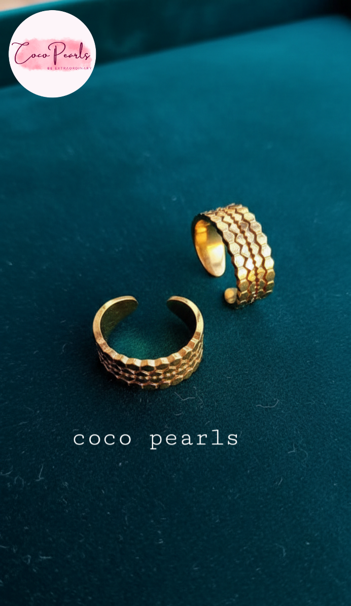 coco pearls stainless steel anti tarnish gold hive adjustable ring displayed on a dark background