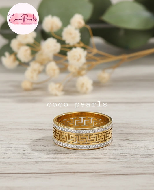 coco pearls stainless steel anti tarnish golden greco glam diamond studded ring displayed on marble surface