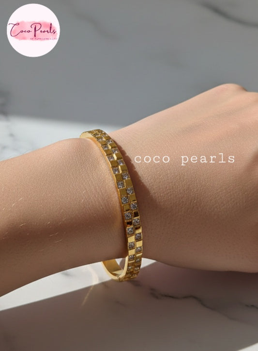 Coco Pearls Stainless Steel Anti tarnish gold grid spark handcuff with diamond grid design displayed on hand