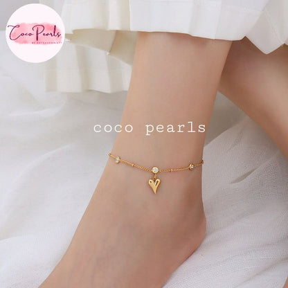 Coco Pearls Stainless Steel Anti Tarnish Gold heartbeat anklet with heart charm on a foot