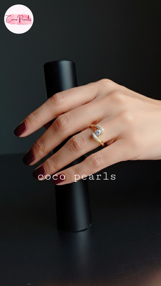 coco pearls stainless steel anti tarnish gold heart spark ring diamond studded with a big diamond in center displayed on hand