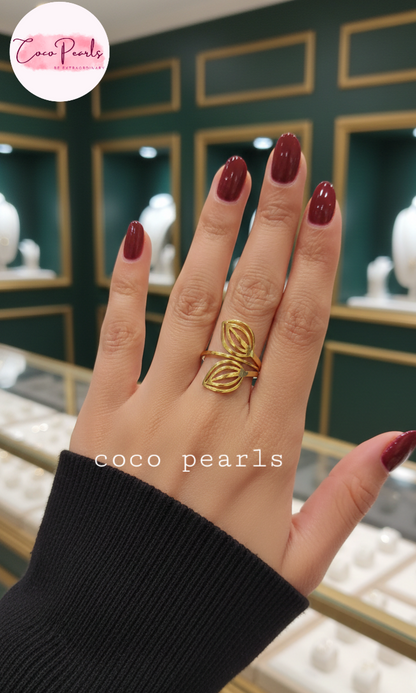 coco pearls stainless steel anti tarnish gold leaf twist ring displayed on a hand
