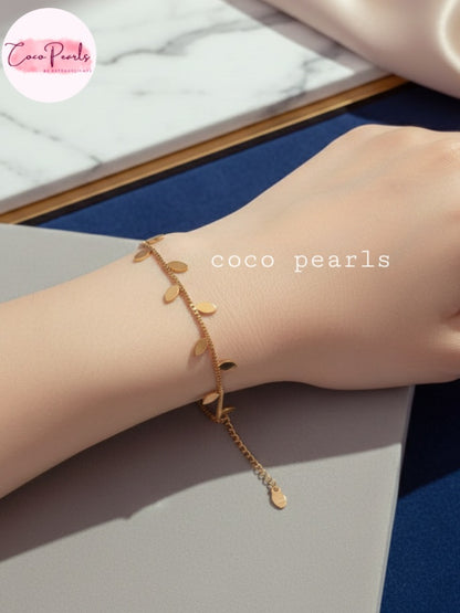 Coco Pearls Stainless steel Anti tarnish Gold leafy bracelet with leafy design on a wrist