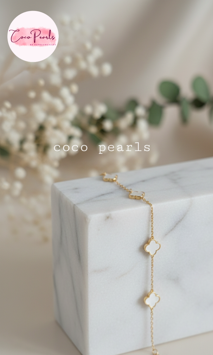Coco Peals Stainless Steel anti  tarnish Gold little clover bracelet with clover-shaped charms on a white surface