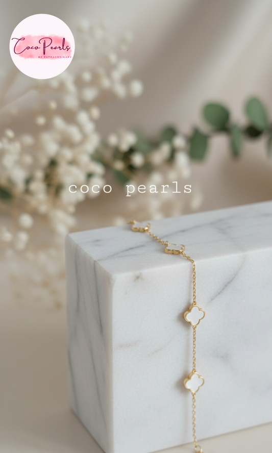 Coco Peals Stainless Steel anti  tarnish Gold little clover bracelet with clover-shaped charms on a white surface