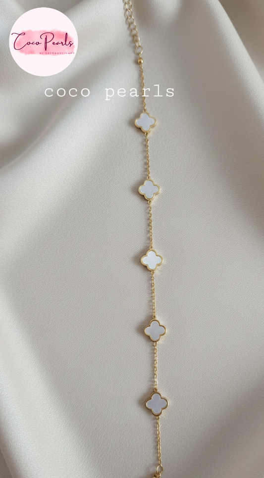 Coco Peals Stainless Steel anti  tarnish Gold ;ittle clover bracelet with clover-shaped charms on a white surface