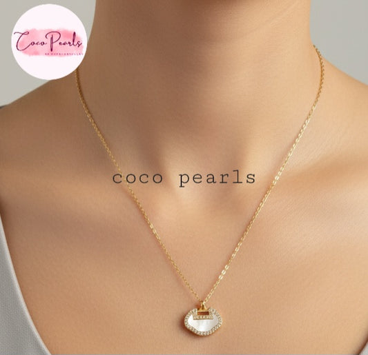 Coco Pearls Stainless Steel Anti Tarnish Gold loop glam necklace with white irregular shape pendant on a mannequin