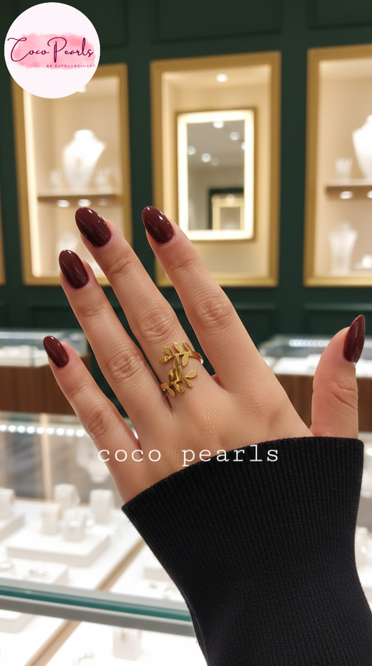 coco pearls stainless steel anti tarnish gold love knot ring displayed on hand