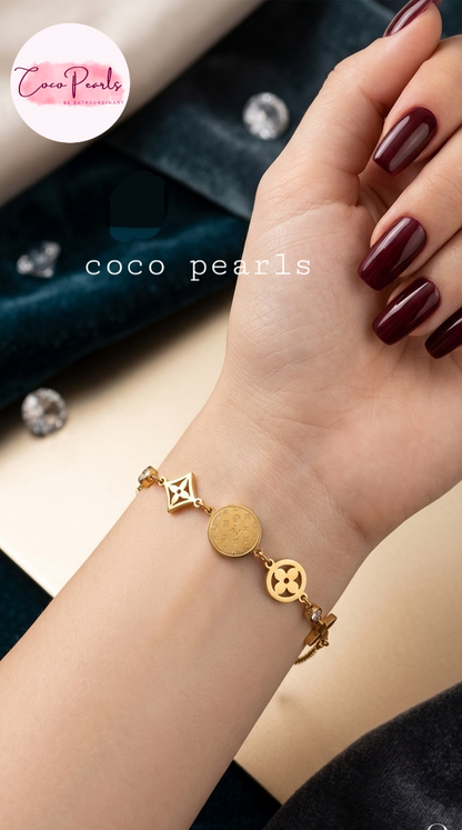 coco pearls stainless steel anti tarnish Gold lucky charm bracelet with intricate designs on hand