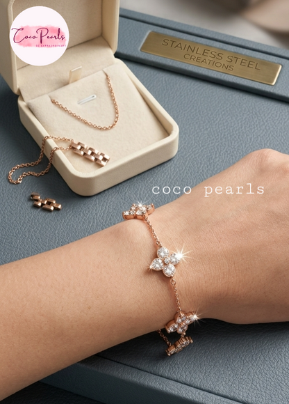 coco pearls stainless steel jewelry pakistan anti tarnish waterproof gold lucky four clover shaped diamond studded bracelet displayed on hand