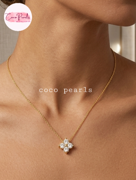 coco pearls stainless steel jewelry pakistan anti tarnish waterproof gold lucky four clover shaped diamond studded necklace displayed on neck