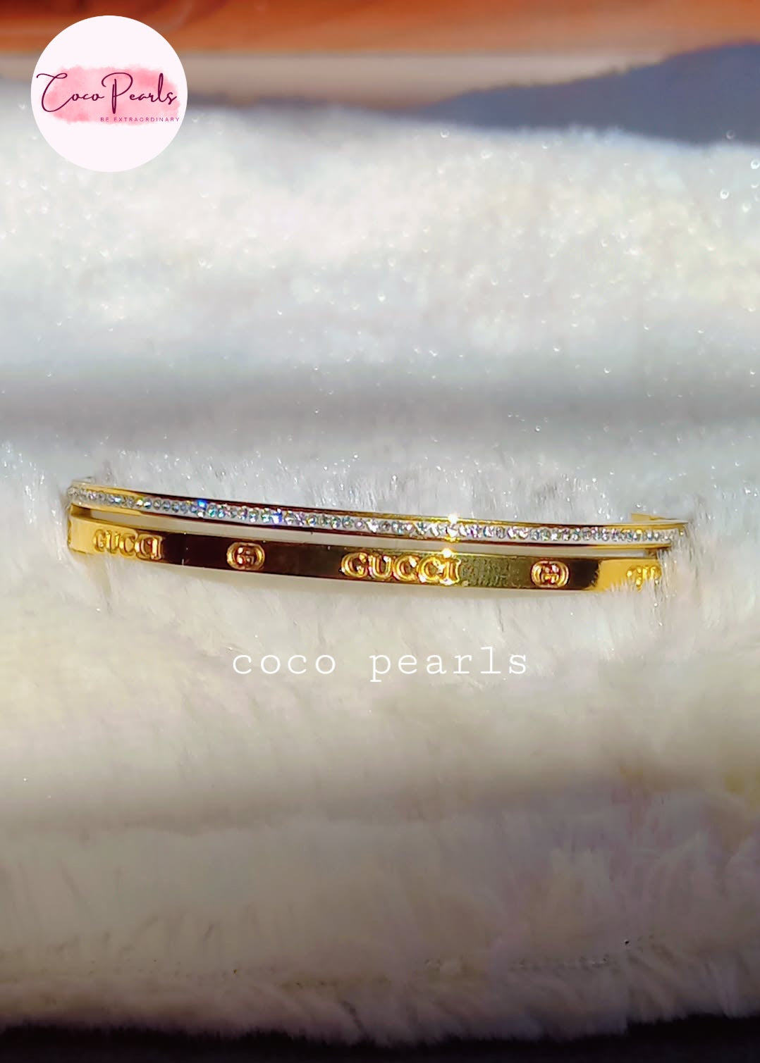 Coco Pearls stainless steel anti tarnish golden luxury sparkle handcuff with diamond studded line displayed on white fabric