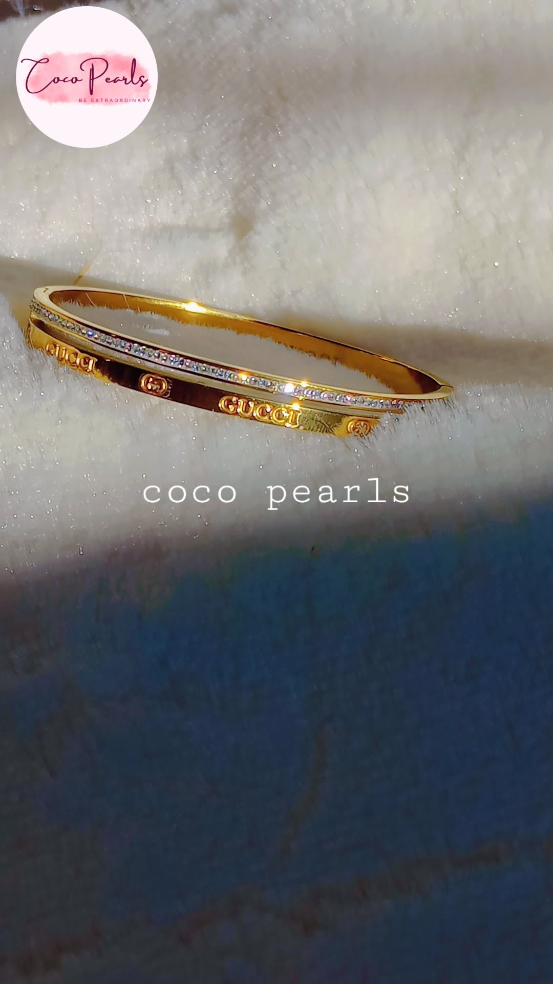 Coco Pearls stainless steel anti tarnish golden luxury sparkle handcuff with diamond studded line displayed on white fabric