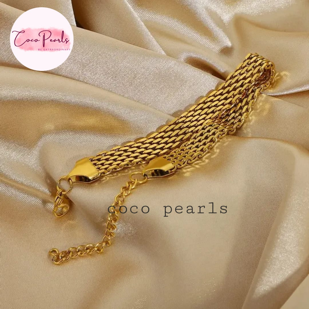 Coco Pearls Stainless steel anti tarnish Gold chain bracelet on a beige satin background