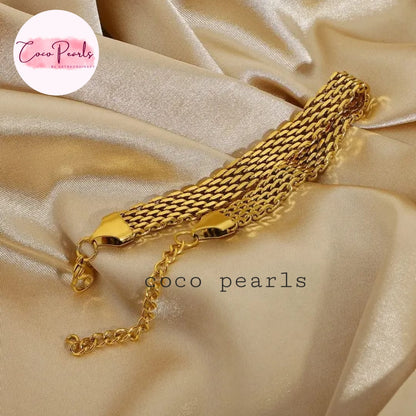 Coco Pearls Stainless steel anti tarnish Gold chain bracelet on a beige satin background