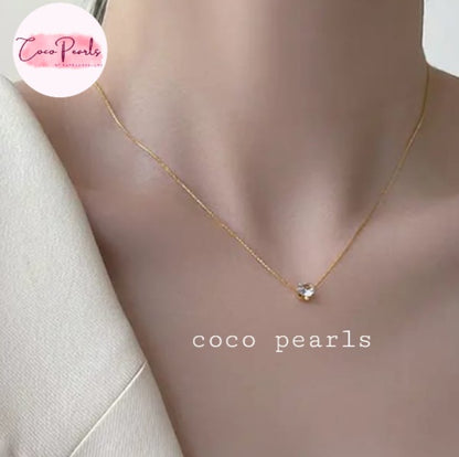Coco Pearls Stainless Steel Anti Tarnish Gold milestone necklace with a diamond pendant on a mannequin