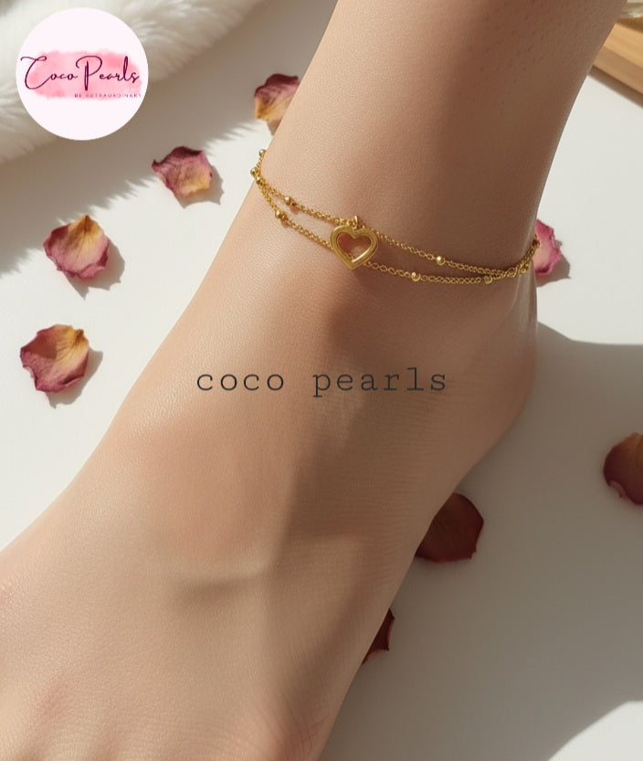 Coco Pearls Stainless Steel Anti Tarnish Gold minimal love anklet on a person's ankle 