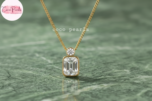 Coco Pearls Stainless Steel Anti Tarnish onyx obsession Gold necklace with a green rectangular gemstone and a small round gemstone on top with a gold chain.
