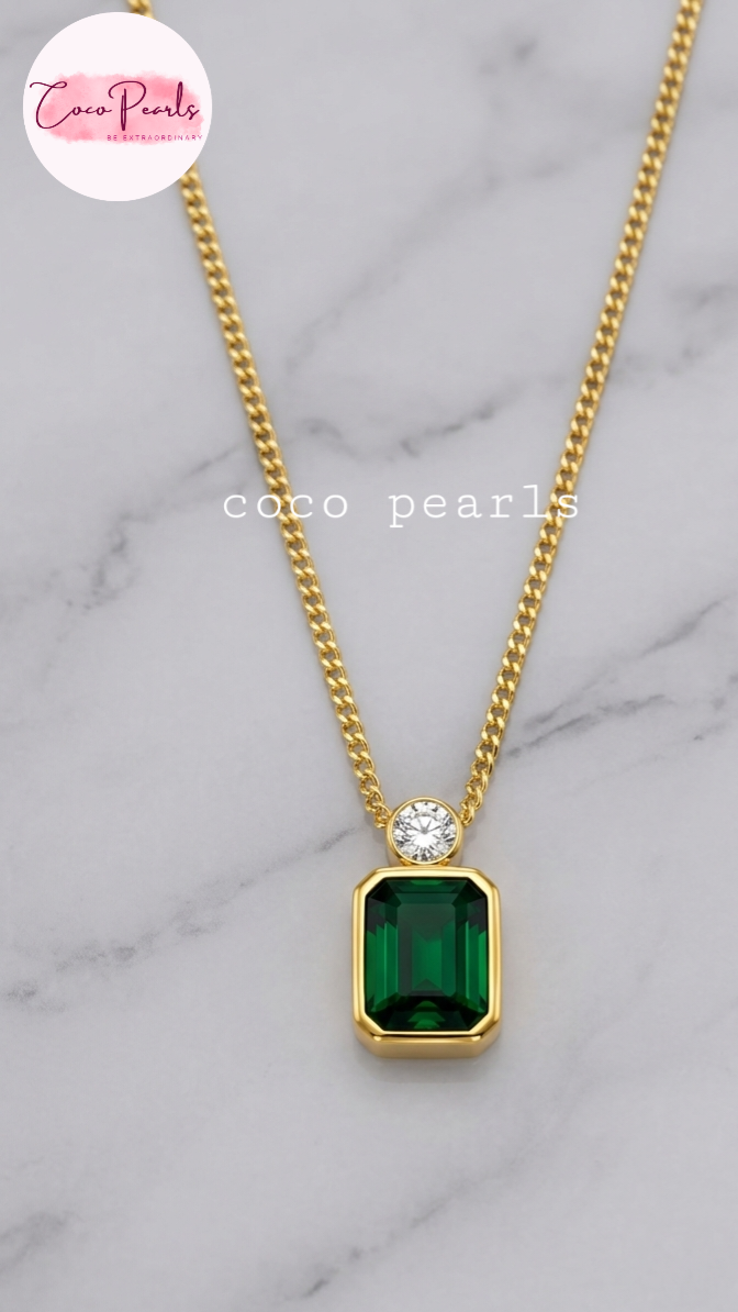 Coco Pearls Stainless Steel Anti Tarnish onyx obsession Gold necklace with a green rectangular gemstone and a small round gemstone on top with a gold chain.