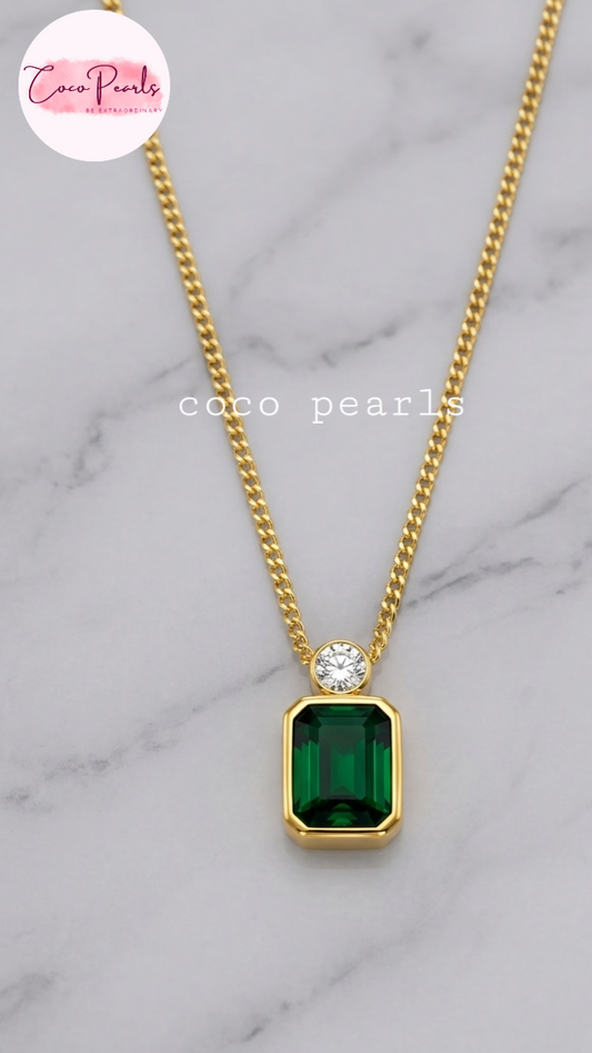 Coco Pearls Stainless Steel Anti Tarnish onyx obsession Gold necklace with a green rectangular gemstone and a small round gemstone on top with a gold chain.