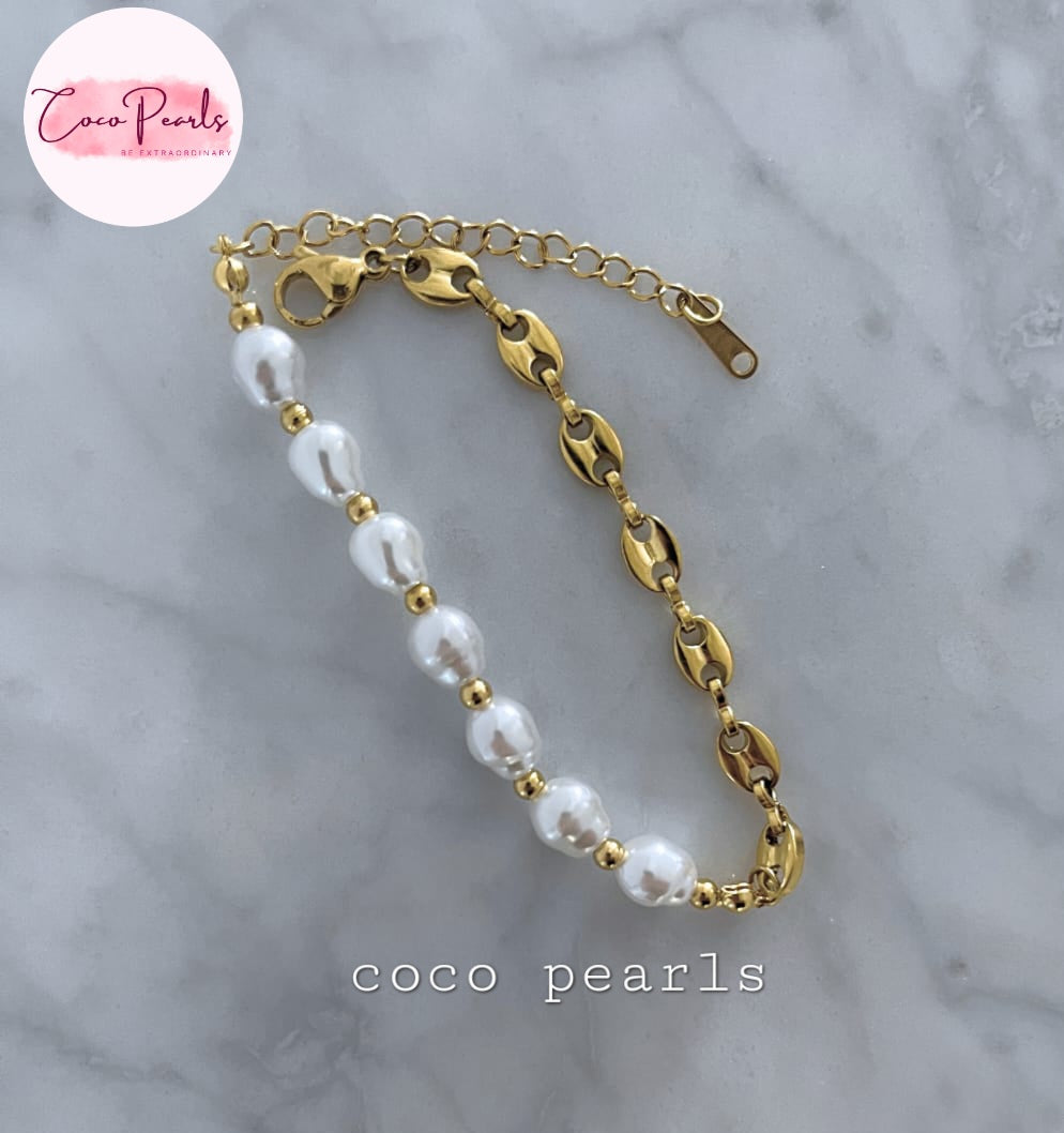 Coco Pearls Stainless Steel Anti Tarnish Pearl cascade bracelet with gold chain  and pearls on a marble surface