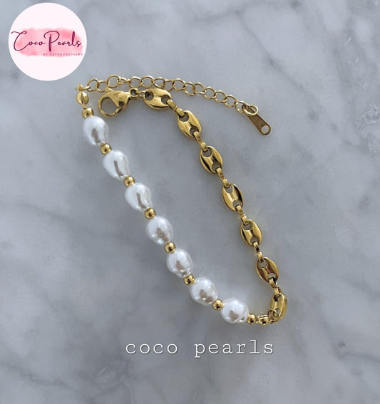 Coco Pearls Stainless Steel Anti Tarnish Pearl cascade bracelet with gold chain  and pearls on a marble surface
