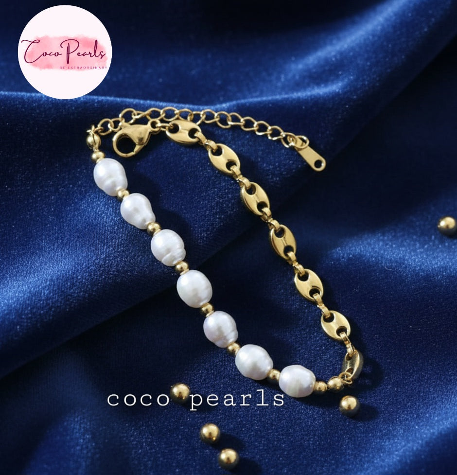 Coco Pearls Stainless Steel Anti Tarnish Pearl cascade bracelet with gold chain  and pearls on a blue background