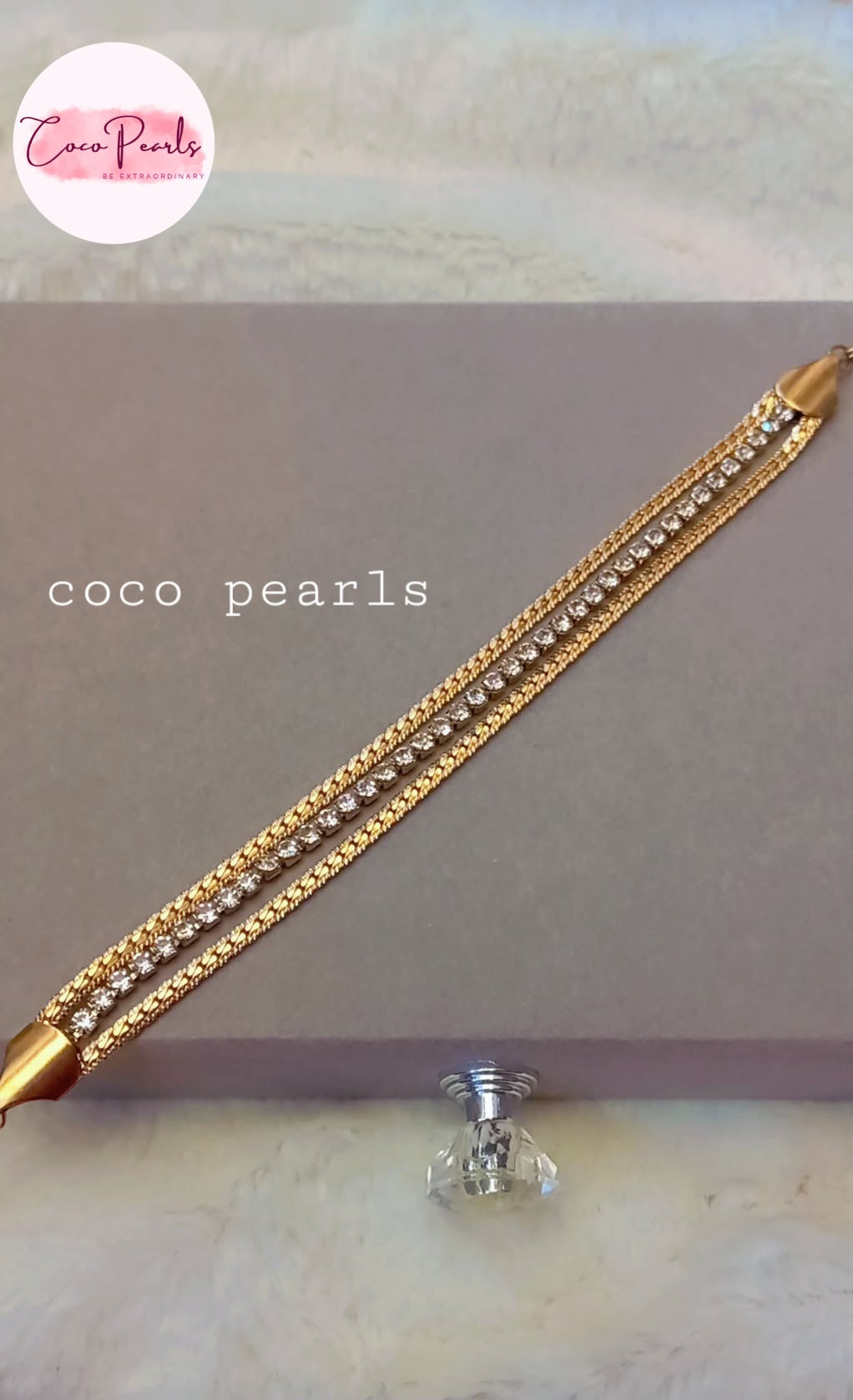 Coco Pearls Stainless Steel Anti tarnish gold radiant river bracelet. 3 layer stack bracelet displayed on grey background.