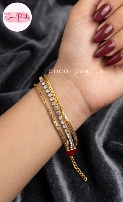 Coco Pearls Stainless Steel Anti tarnish gold radiant river bracelet. 3 layer stack bracelet with diamond studded line with chain on both side displayed on hand