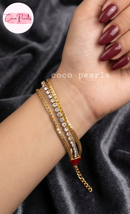 Coco Pearls Stainless Steel Anti tarnish gold radiant river bracelet. 3 layer stack bracelet with diamond studded line with chain on both side displayed on hand