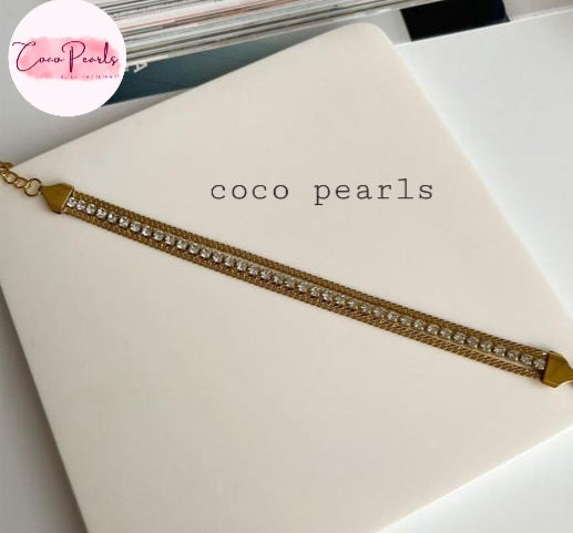 Coco Pearls Stainless Steel Anti tarnish gold radiant river bracelet. 3 layer stack bracelet with diamond studded line with chain on both side displayed on white background.